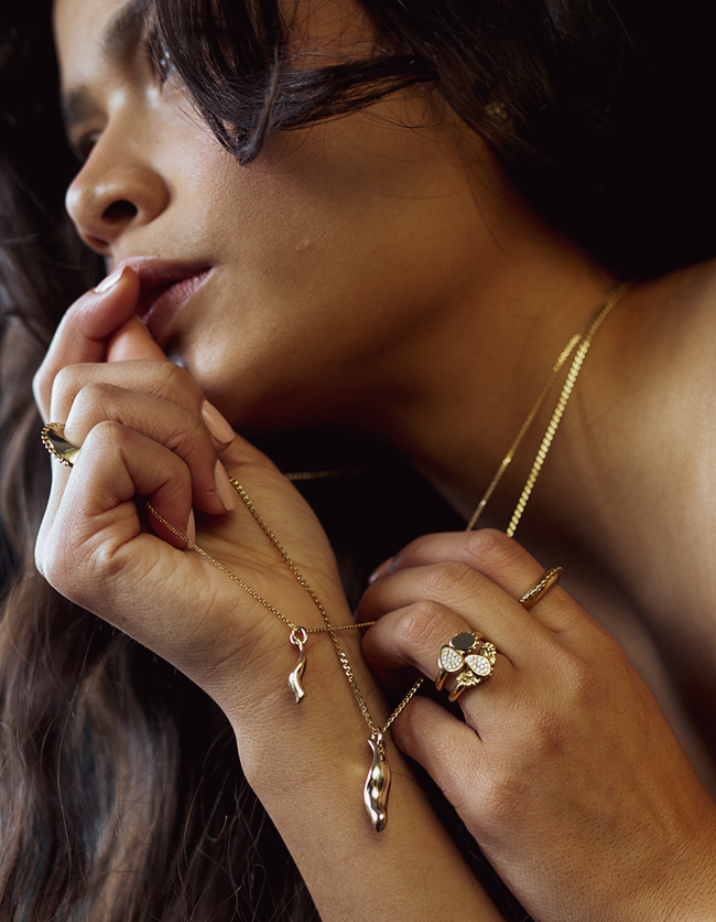 Baby wearing 2025 gold jewelry